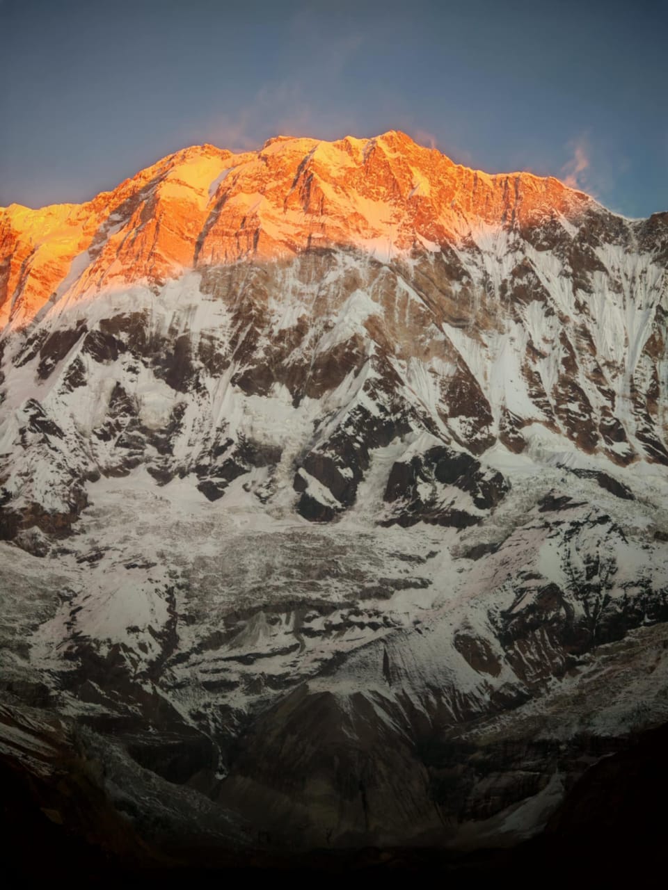 Mesmerizing sunrise glow on Machhapuchhre peak during Annapurna Base Camp trek in Nepal Himalayas
