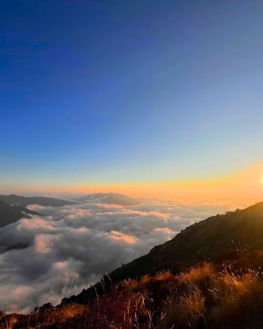 Village below snow-capped Annapurna peaks, Khopra Danda Trek