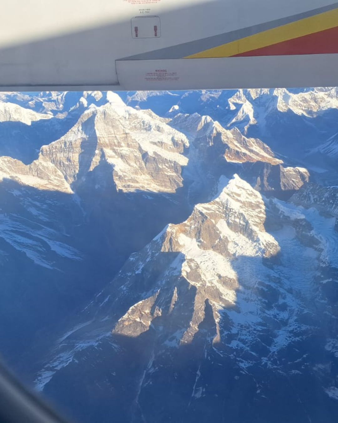 Snow covered Himalayan peaks seen from Everest scenic flight