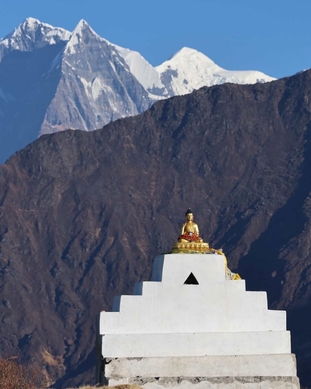 Golden stupa overlooking Himalayas, Khopra Danda Trek