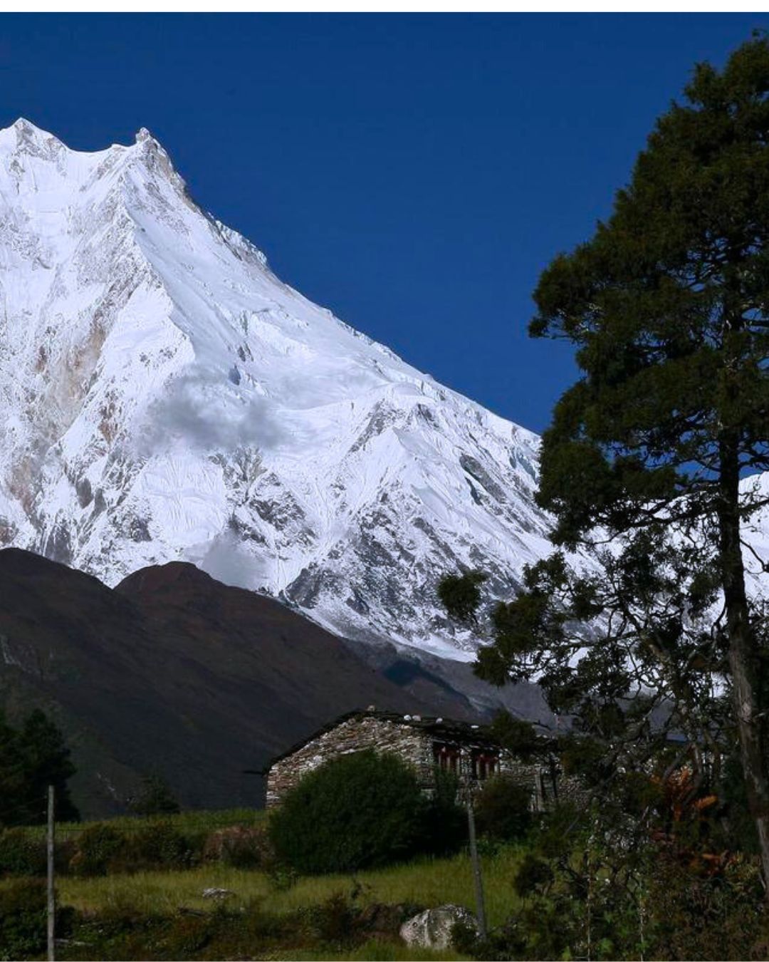 Prayer flags and mani walls along Tsum Valley trek