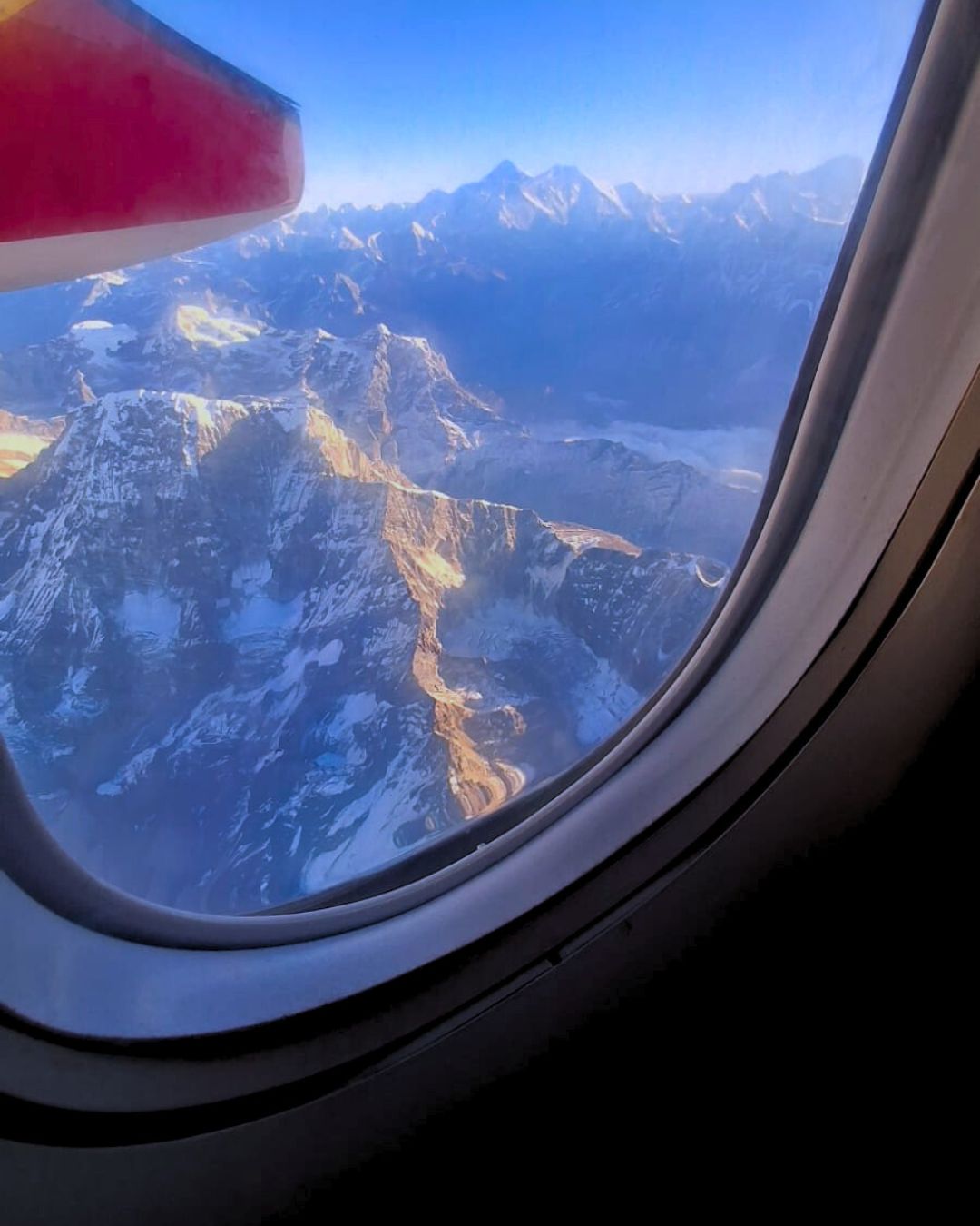 View of Himalayas from window seat on Everest mountain flight