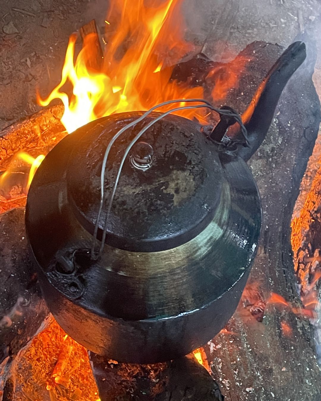 Tea kettle over campfire during Api Himal Base Camp Trek