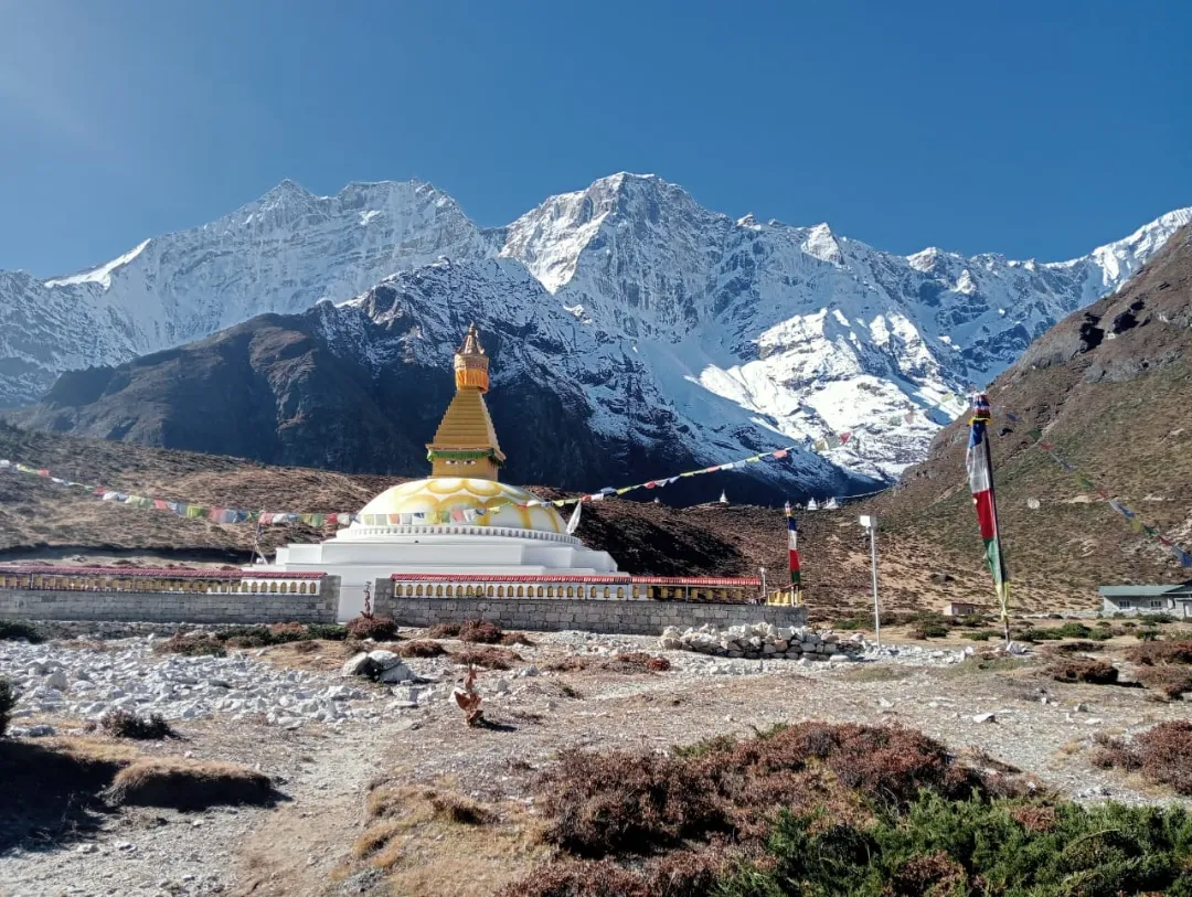 Buddhist stupa with snow-covered Himalayan mountains on Everest Three Passes Trek